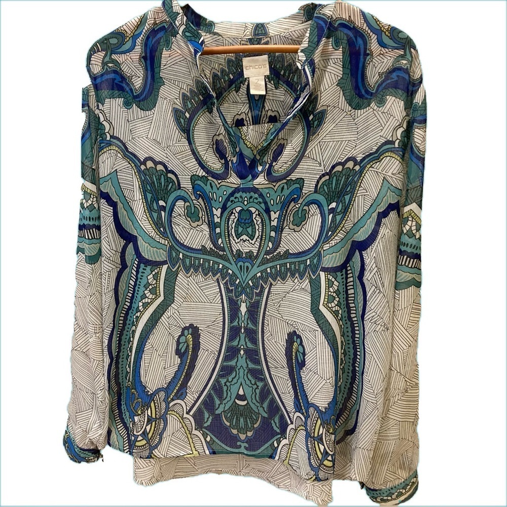 Chico’s sheer blouse. Shades of blue on white/black geometric print. Size 2